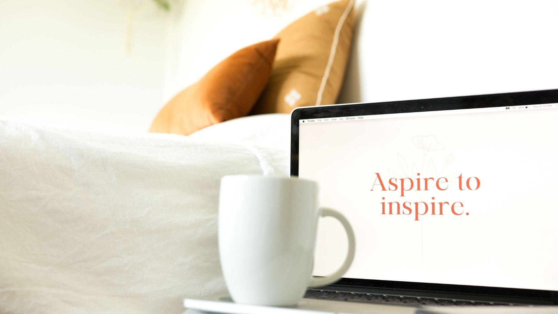 Laptop with an inspirational message: Aspire to Inspire