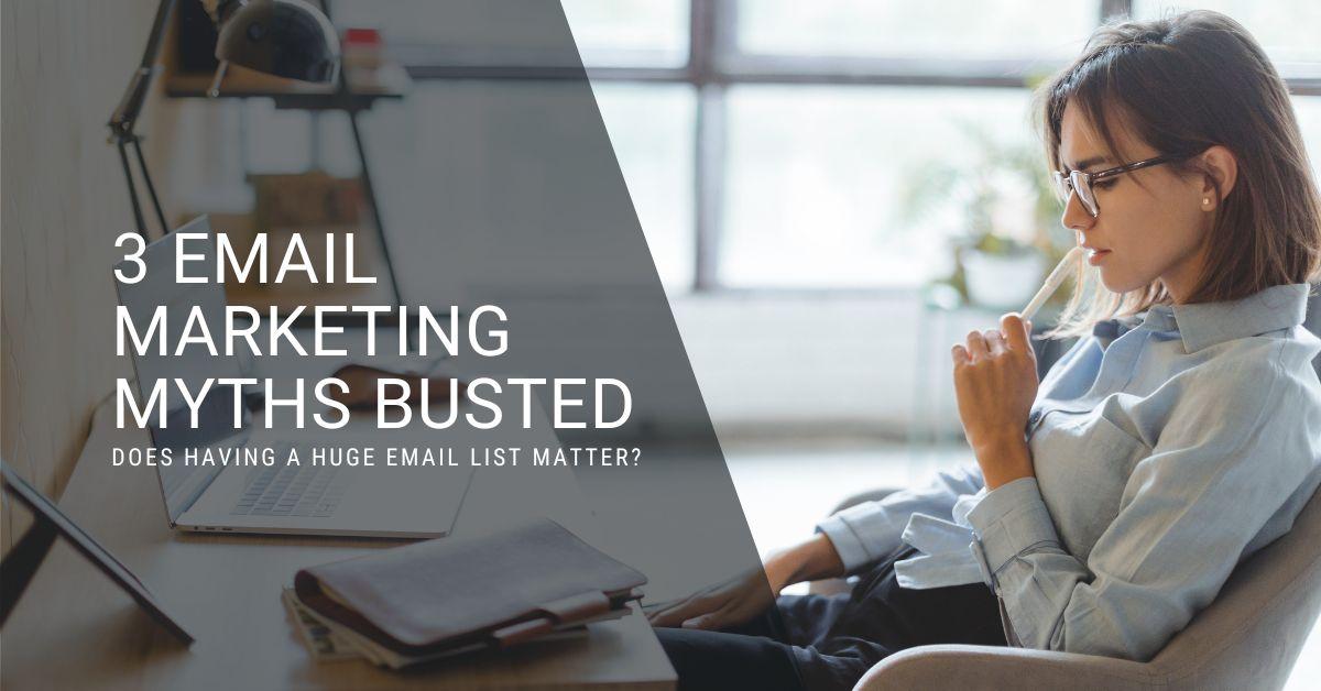 Woman sitting at her laptop reading the blog post: 3 Email Marketing Myths Busted